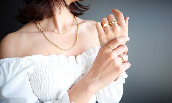 Woman wearing gold jewelry